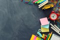 Education and back to school concept. stationery and bus over classroom blackboard. top view, flat lay Royalty Free Stock Photo