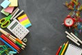 Education and back to school concept. stationery over classroom blackboard. top view, flat lay Royalty Free Stock Photo