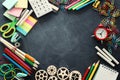 Education and back to school concept. stationery over classroom blackboard. top view, flat lay Royalty Free Stock Photo