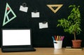 Education background. Back to school concept. Laptop with blank screen on the table. Royalty Free Stock Photo