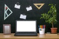 Education background. Back to school concept. Laptop with blank screen on the table. Royalty Free Stock Photo