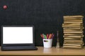 Education background. Back to school concept. Laptop with blank screen on the table. Royalty Free Stock Photo