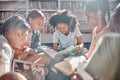 Education, books or students reading in a library for group learning development or growth. Storytelling, kids or happy Royalty Free Stock Photo