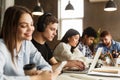 Education concept. College students studying in campus library