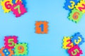 Colorful kids numbers toys on blue background