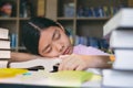 Girl reading and writing and do homework in library Royalty Free Stock Photo