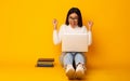 Education Concept. Happy Student Girl With Books And Laptop, Yellow Background Royalty Free Stock Photo