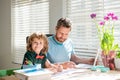 education concept. homeschooling and help. back to school. parenthood. cheerful father and son Royalty Free Stock Photo