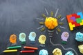 Education concept image. Creative idea and innovation. Crumpled paper as lightbulb metaphor over blackboard Royalty Free Stock Photo