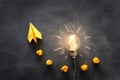 Education concept image. Creative idea and innovation. Light bulb as metaphor over blackboard Royalty Free Stock Photo