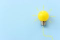 Education concept image. Creative idea and innovation. light bulb metaphor over blue background Royalty Free Stock Photo