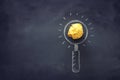 Education concept image. Creative idea and innovation. Magnifying glass as finding the right target metaphor, over blackboard Royalty Free Stock Photo
