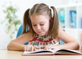 Education concept - little student kid reading Royalty Free Stock Photo