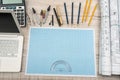 Education concept. Mathematics project with millimeter paper and tools for drafting, laptop, calculator Royalty Free Stock Photo