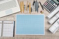 Education concept. Mathematics project with millimeter paper and tools for drafting, laptop, calculator Royalty Free Stock Photo