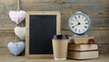 Education concept. Online education course. Books and disposable cup on wooden surface Royalty Free Stock Photo