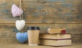 Education concept. Online education course. Books and disposable cup on wooden surface Royalty Free Stock Photo