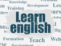 Education concept: Learn English on wall background Royalty Free Stock Photo