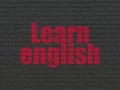 Education concept: Learn English on wall background Royalty Free Stock Photo