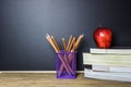 Education concept. Pencil on table and red apple on book. Royalty Free Stock Photo