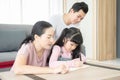 Education concept.Portrait enjoy happy smiling love asian family father and mother with little asian girl learning and writing in Royalty Free Stock Photo