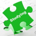 Education concept: Studying on puzzle background