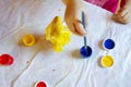 Education concept: toy animal figures are being painted with colorful paints by children. Royalty Free Stock Photo
