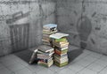 Unnecessary or useful knowledge? Stack of books cast shadows in form of light bulb and shape of trash can. 3d i Royalty Free Stock Photo