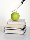 Education cuts on the way. Metaphor. Royalty Free Stock Photo