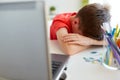 Tired or sad student boy with laptop at home Royalty Free Stock Photo