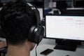 Education e-learning foreign languages Concept : Asian Student Young man wearing Headphones listening English songs music and