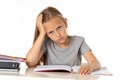 Young school student girl looking unhappy and tired in education concept Royalty Free Stock Photo