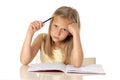 Young school student girl looking unhappy and tired in education concept Royalty Free Stock Photo