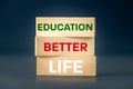 education equals a better life, Concept, written words, better life education, on wooden blocks, Motivating slogan, beautiful navy Royalty Free Stock Photo