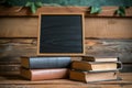 Education essentials small chalkboard with a stack of books concept