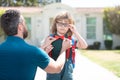 education. first day at school. father and son come back from school. happy family value