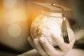 Education in Global, Graduation cap on Businessman holding Earth globe model map with Radar background in hands. Concept of global