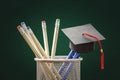 Education and graduate study concept, mortarboard on pencils background