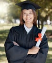 Education, graduation and portrait of woman with diploma on campus for success, award and achievement. University