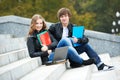 Education and students. Happy young college student with notebooks Royalty Free Stock Photo