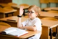 Education, high school, college. Portrait of a funny shouting student boy standing by a school blackboard