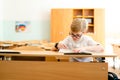 Education, high school, college. Portrait of a funny shouting student boy standing by a school blackboard