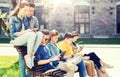 Group of students with tablet pc at school yard