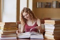 Education, high school, university, learning and people concept. Indoor shot of student girl reading book at library, preparing