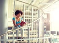 African student girl reading book at library Royalty Free Stock Photo