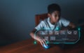 education icon On the background of blurry pictures a boy is staring at a computer monitor. educational concept, educational