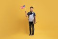 Happy kid school boy showing flag of the US Royalty Free Stock Photo