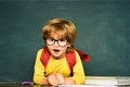Education. Kids gets ready for school. Learning concept. First school day. Happy smiling pupils drawing at the desk Royalty Free Stock Photo