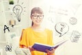 Smiling young asian woman reading book at home Royalty Free Stock Photo