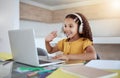 Education, laptop and girl learning a virtual class from her kindergarten teacher via an educational online website Royalty Free Stock Photo